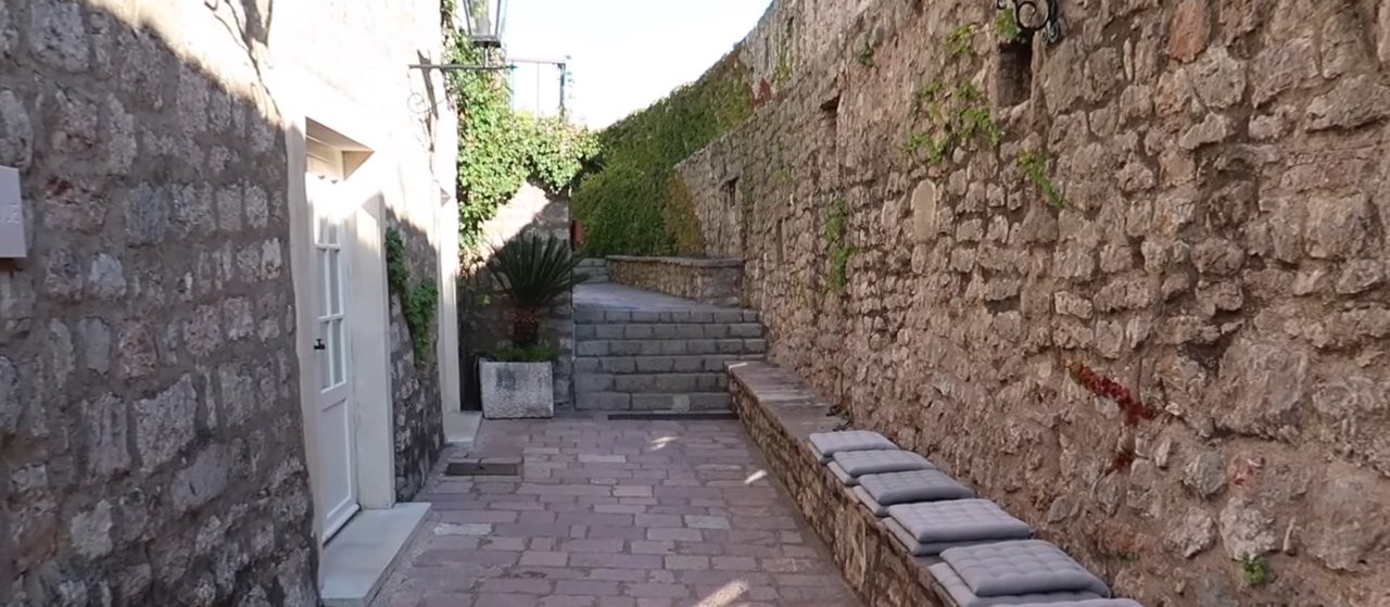 Stone pathways winding upward through the village